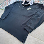 Kooga men's polo shirt in Prince of Wales pattern, featuring logo and regular fit.