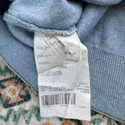 Burberry light blue knitted jumper featuring iconic check pattern and soft merino wool.