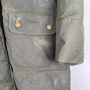 Barbour khaki women's thick down jacket with logo and signs of wear.