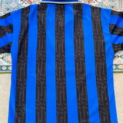Umbro blue and navy striped home jersey with embroidered logo and vintage design.