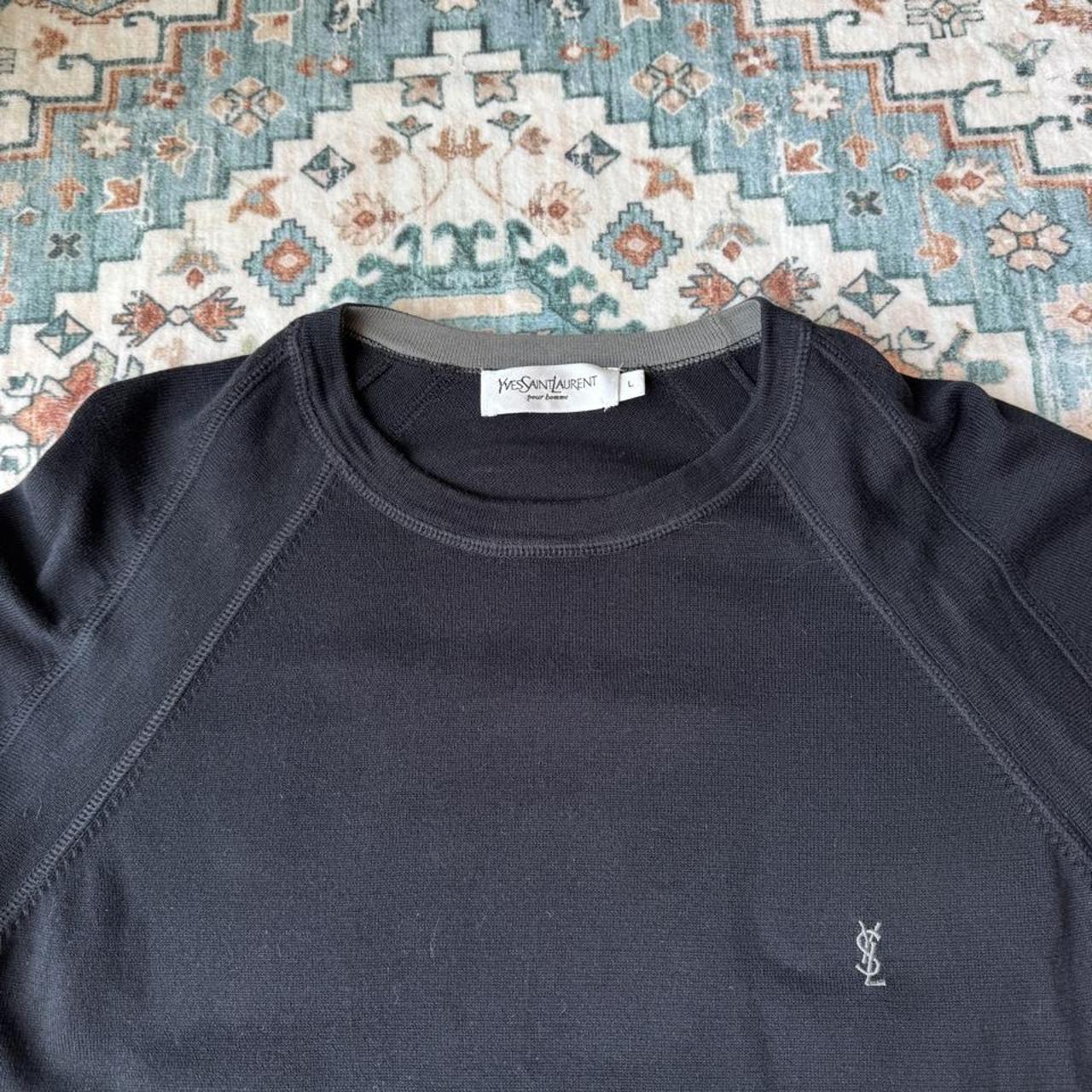 Yves Saint Laurent black knitted sweatshirt with embroidered YSL logo and slim fit.