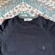 Yves Saint Laurent black knitted sweatshirt with embroidered YSL logo and slim fit.