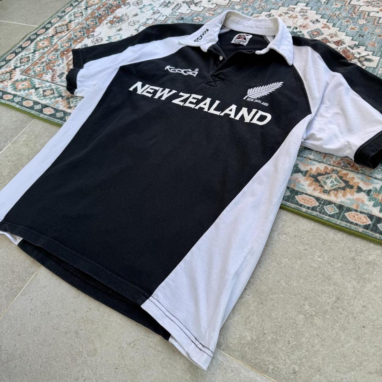 Kooga men's polo shirt, green with embroidered New Zealand logo and rugby collar.