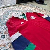 Canterbury men's rugby polo red with British and Irish Lions logo and embroidered details.
