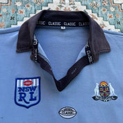 NSW Rugby League blue polo shirt with embroidered logo and vintage 1990s design.
