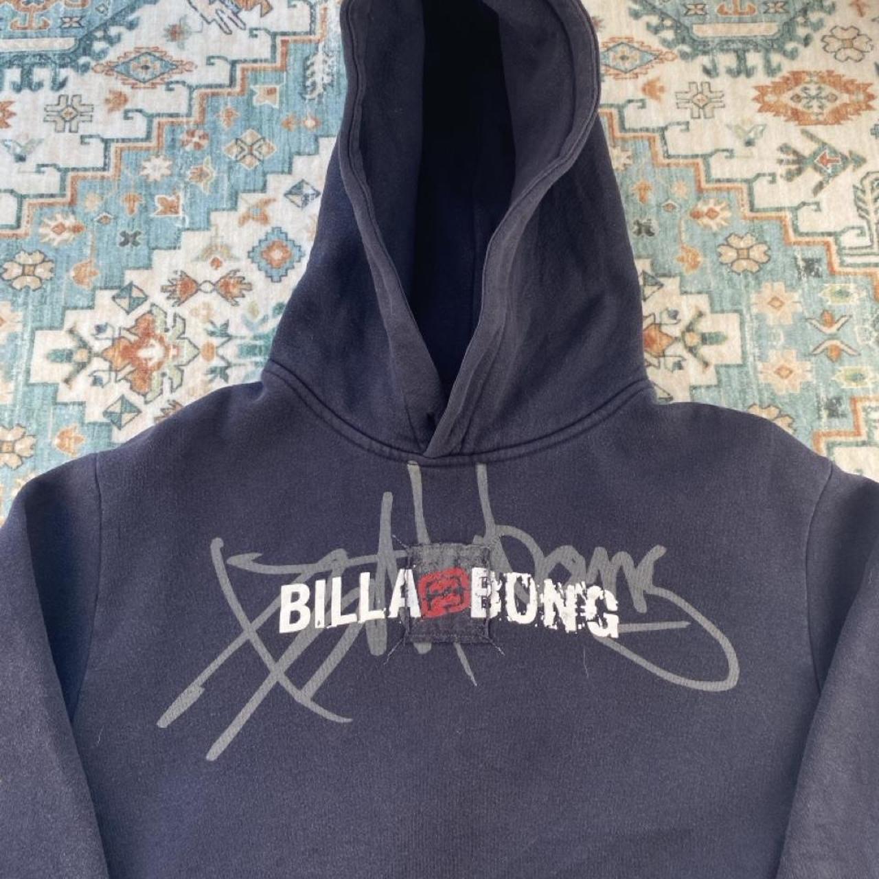 Billabong navy oversized hoodie with logo detail and soft material.