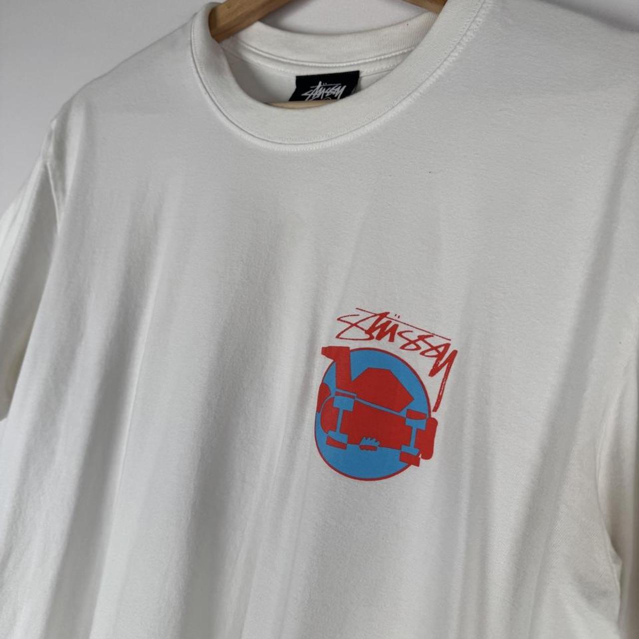 Stüssy graphic t-shirt featuring skateman design, black color, soft cotton material.