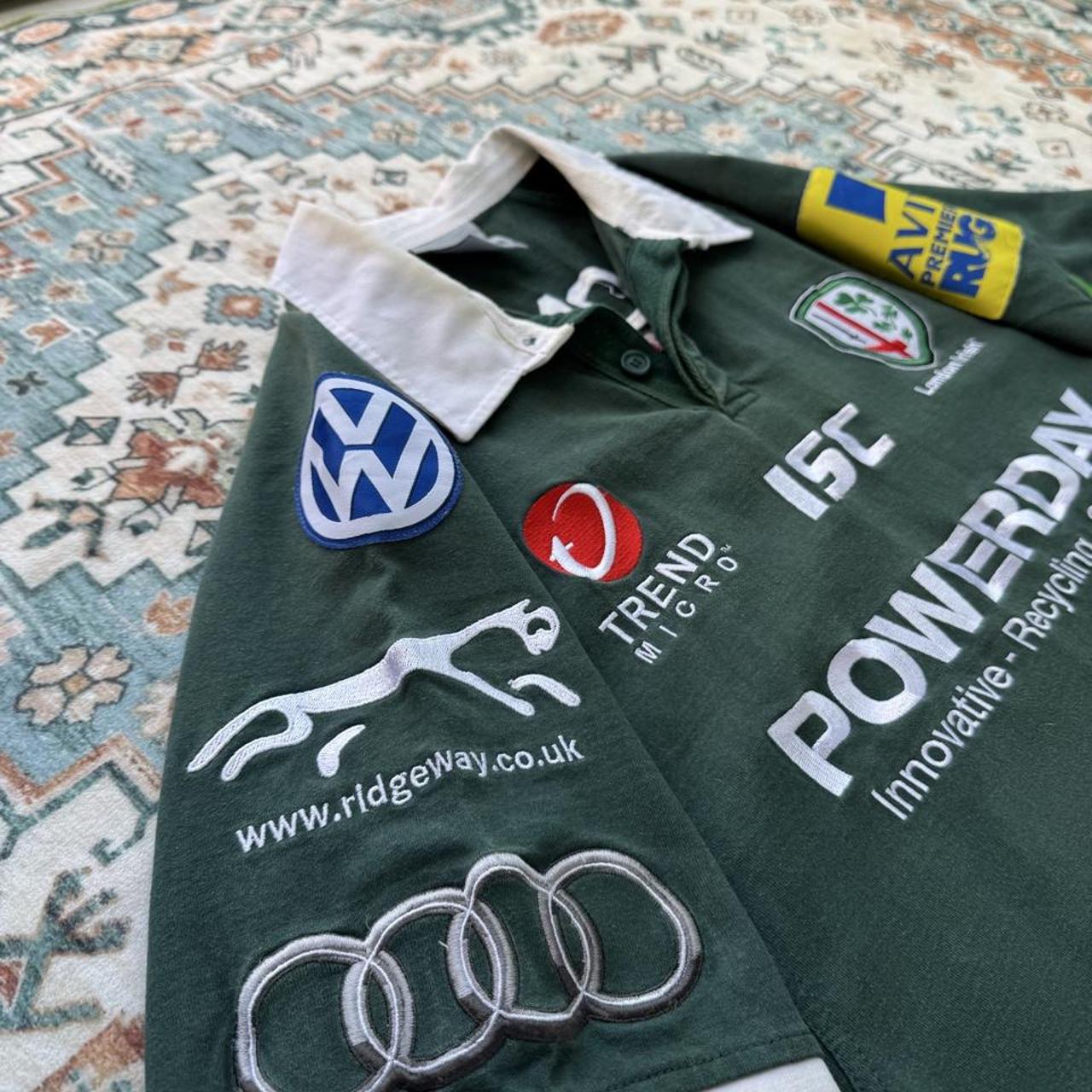 ISC green rugby polo shirt with embroidered London Irish logo and slim fit.