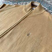 Yves Saint Laurent cream jumper with embroidered YSL logo and full zip design.