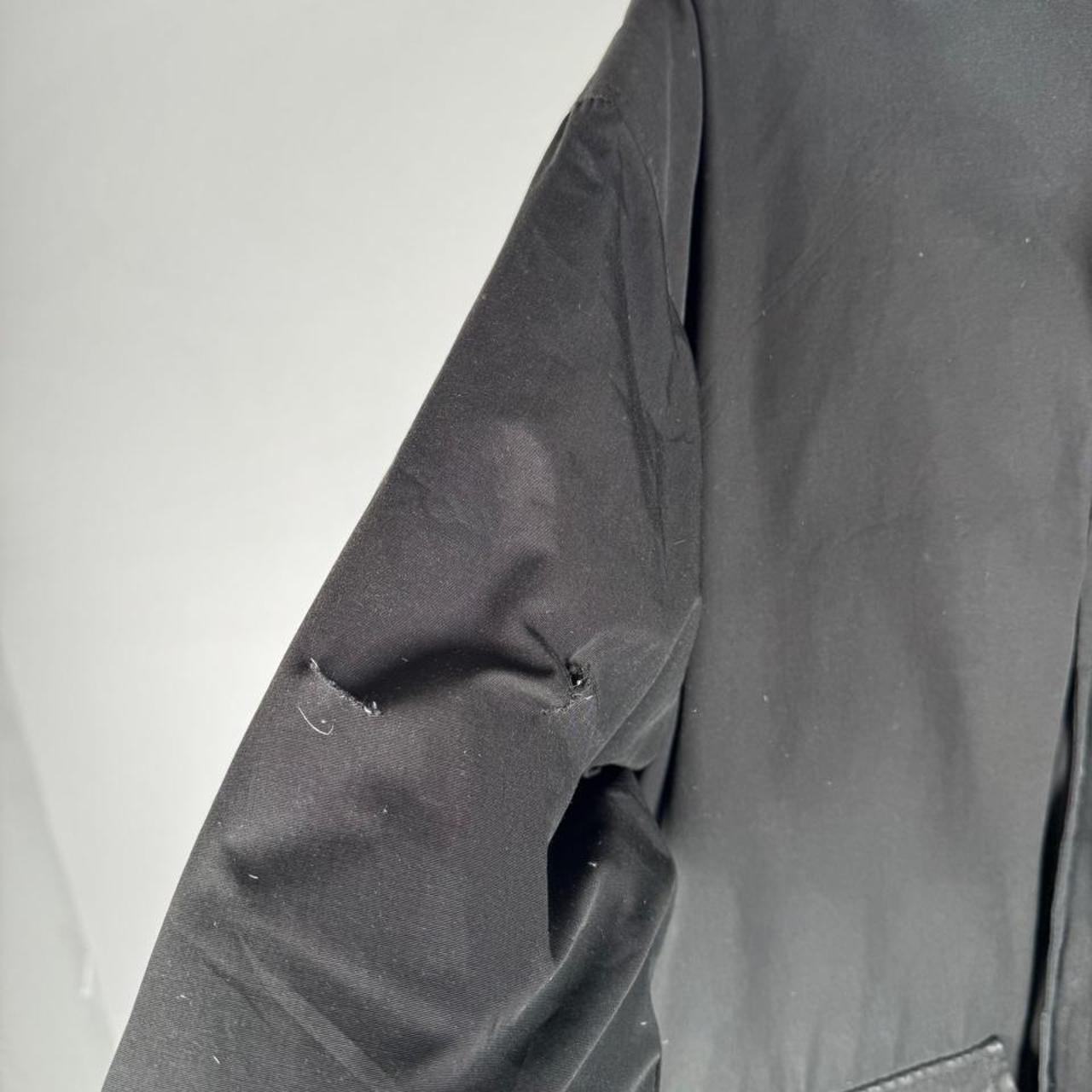Canada Goose battered jacket black with no fur, badge, or visible holes.