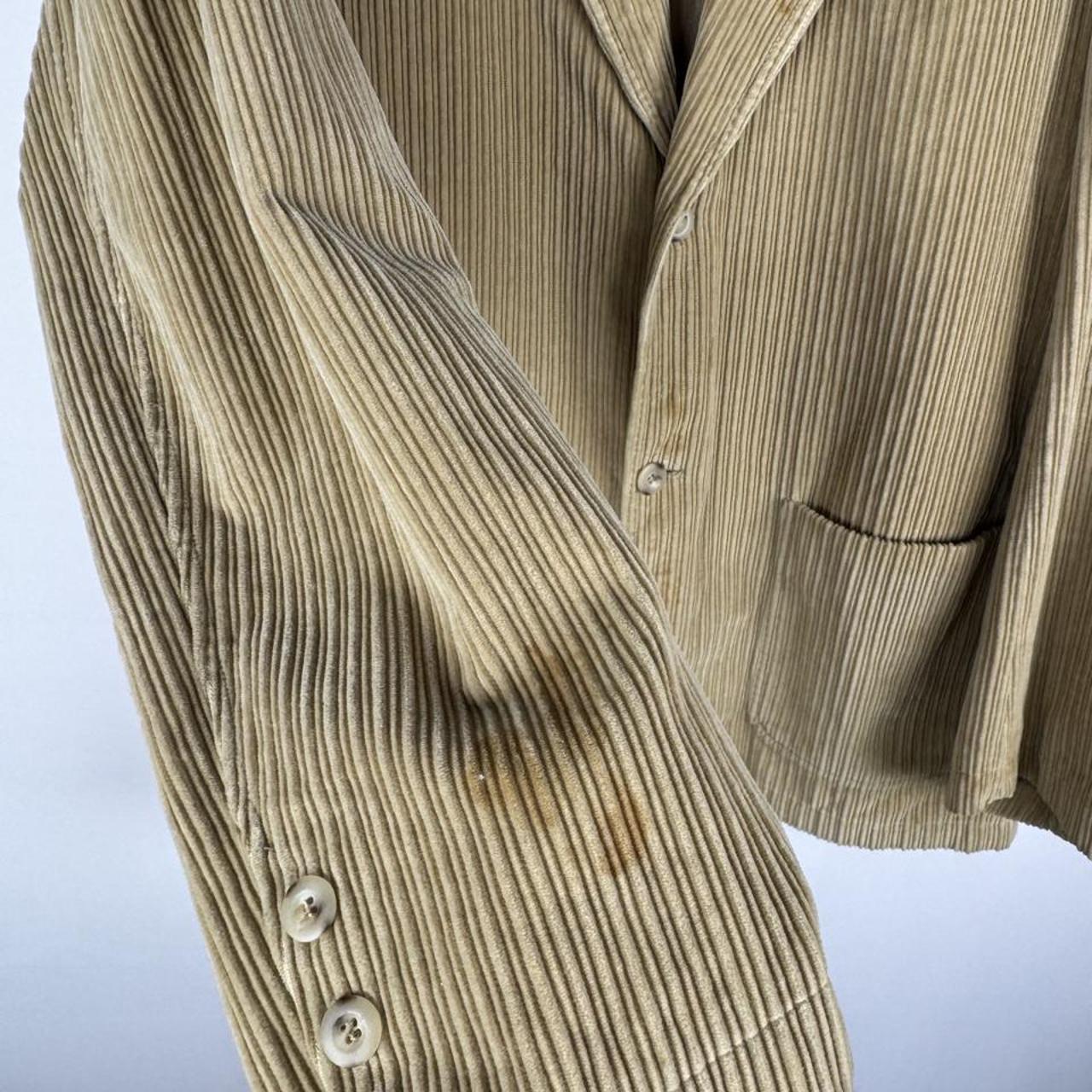 Burberry cream corduroy blazer with subtle logo details and a slim fit design.