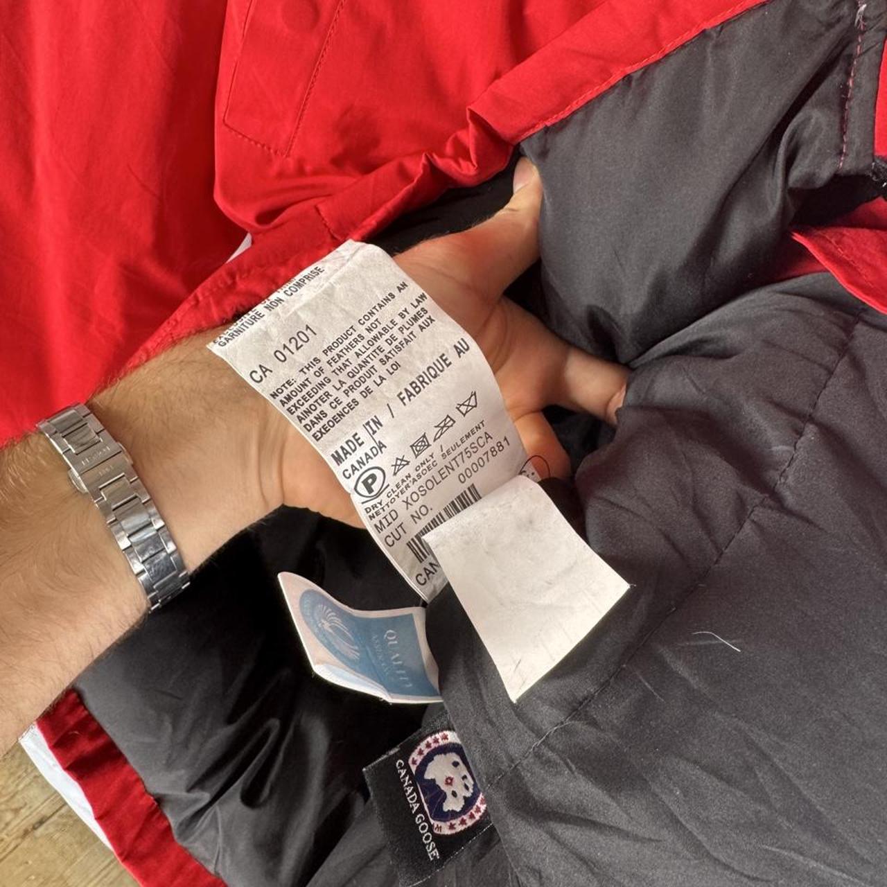 Canada Goose black Montebello parka jacket with fur-lined hood and logo patch.