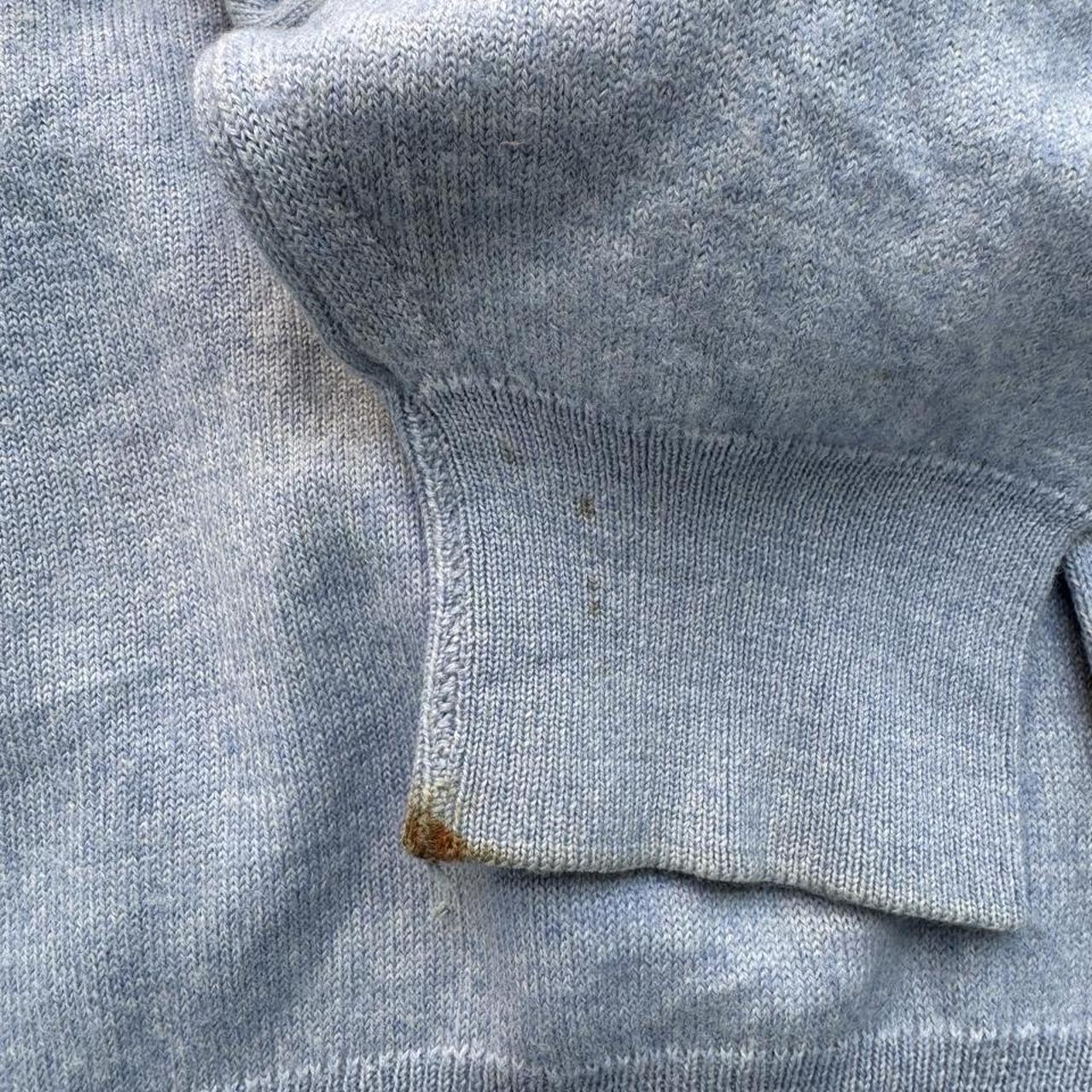 Burberry light blue knitted jumper featuring iconic check pattern and soft merino wool.