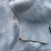 Burberry light blue knitted jumper featuring iconic check pattern and soft merino wool.
