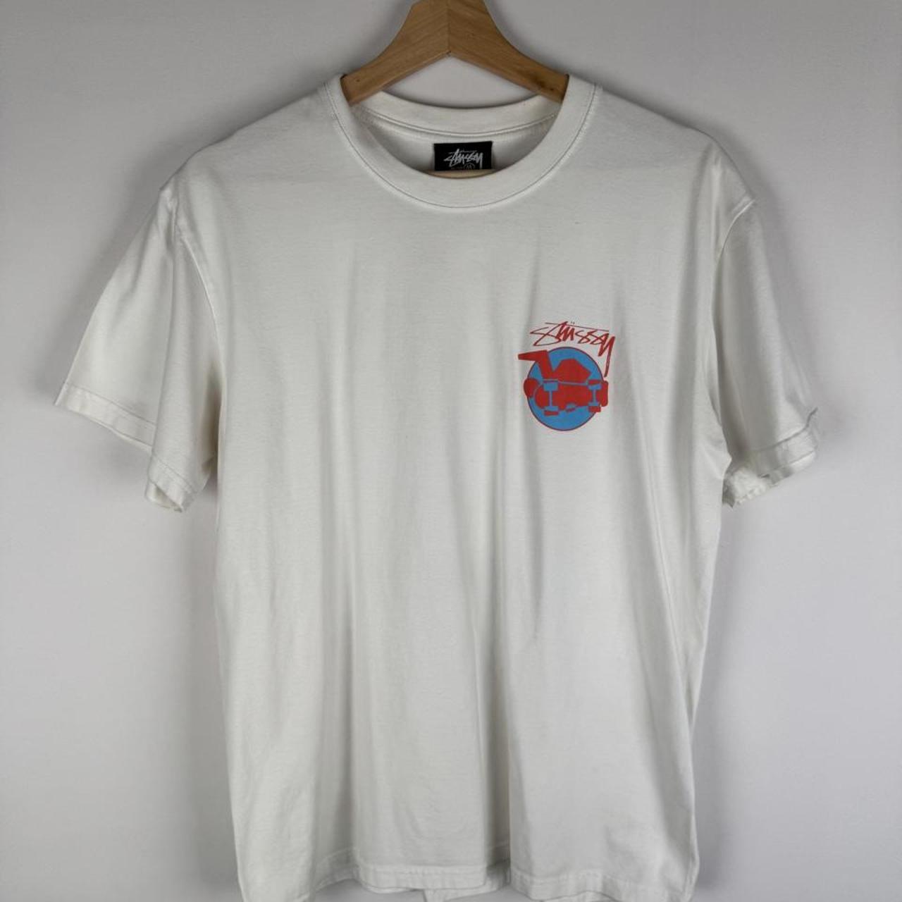 Stüssy graphic t-shirt featuring skateman design, black color, soft cotton material.