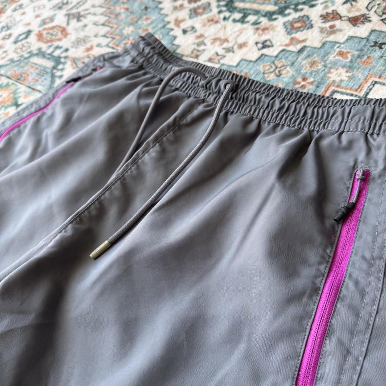 Nike ACG grey cargo training shorts with multiple pockets and logo detail.