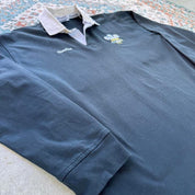 Kooga men's polo shirt in Prince of Wales pattern, featuring logo and regular fit.