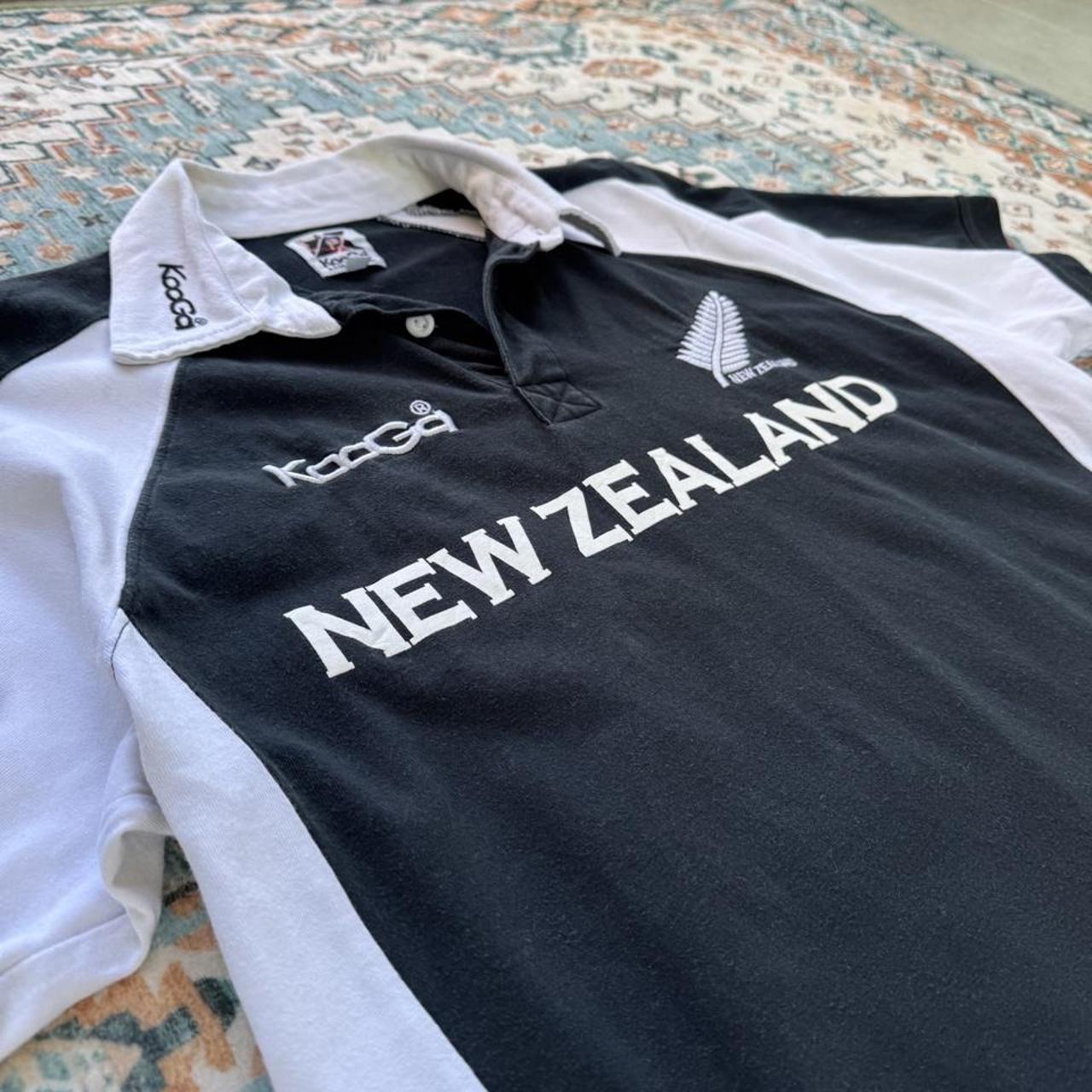 Kooga men's polo shirt, green with embroidered New Zealand logo and rugby collar.