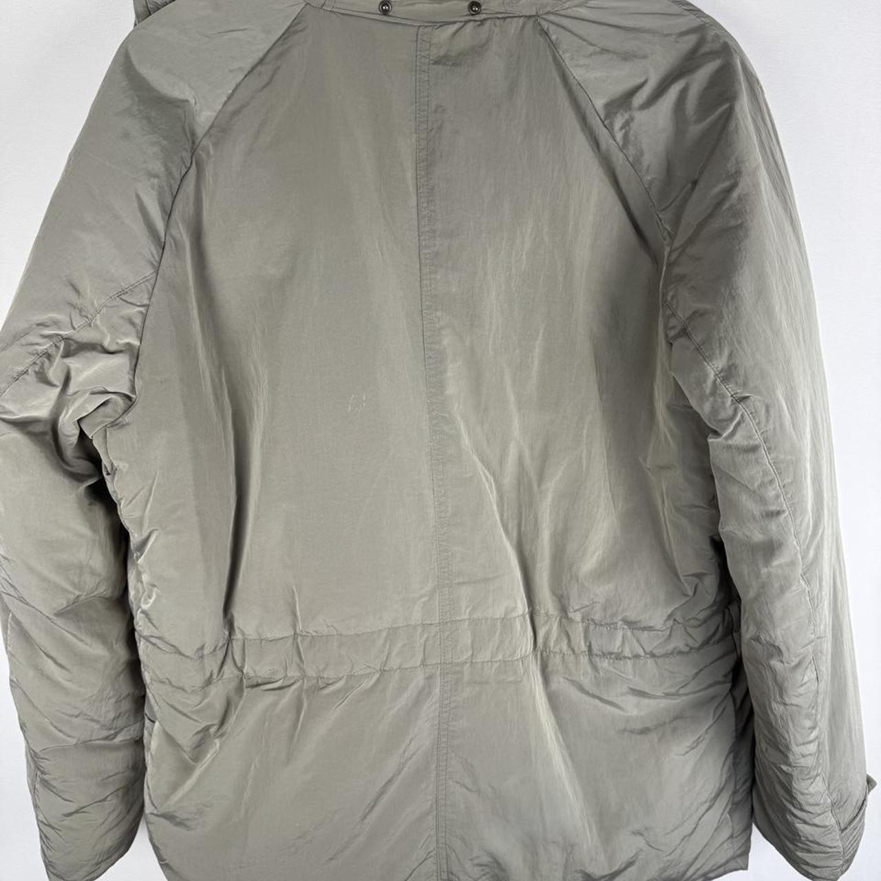 CP Company multi-colour utility parka jacket with multiple pockets and hood.