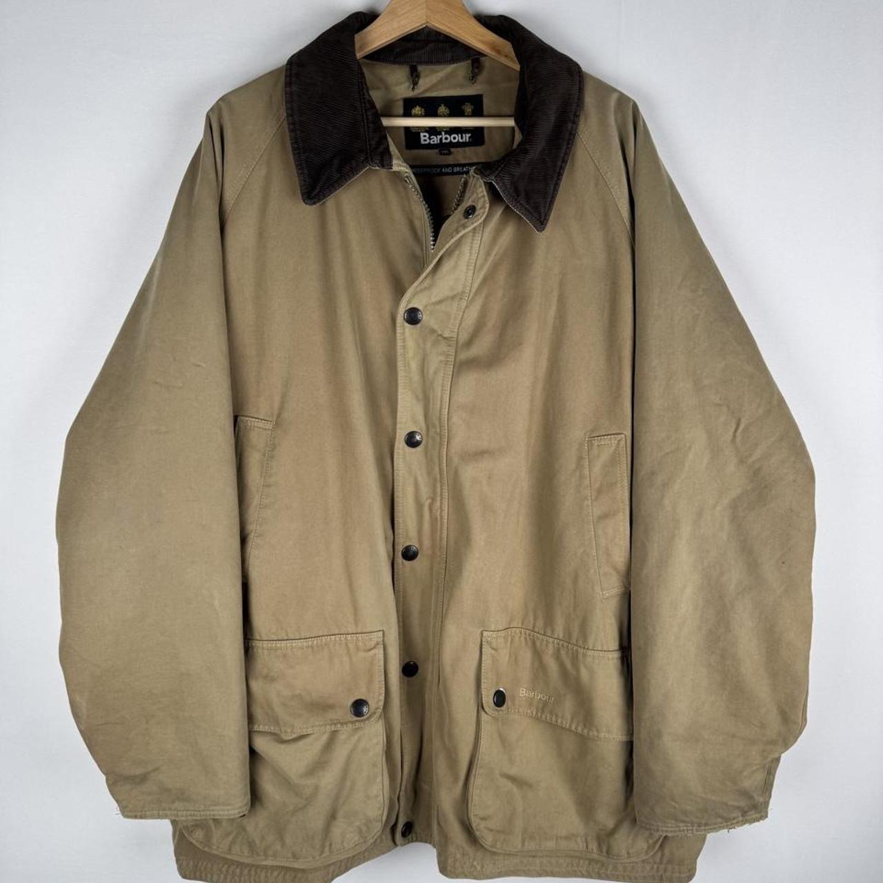 Barbour beige heavyweight cotton Beaufort jacket with classic tartan lining and logo.