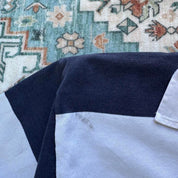 Canterbury men's rugby polo shirt, navy blue, featuring Harper Adams University logo and classic collar.