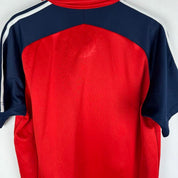 Adidas men's polo shirt in green with embroidered logo and classic collar.