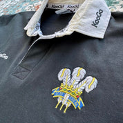 Kooga men's polo shirt in Prince of Wales pattern, featuring logo and regular fit.