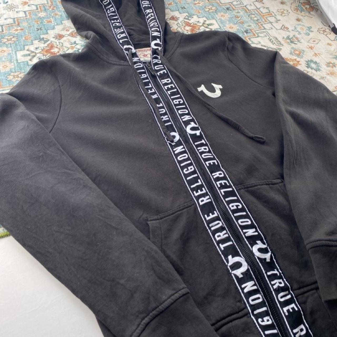 True Religion black and white full zip hoodie with logo and contrast stitching.