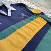 Canterbury men's long sleeve rugby polo green with Australia Wallabies logo and embroidered details.