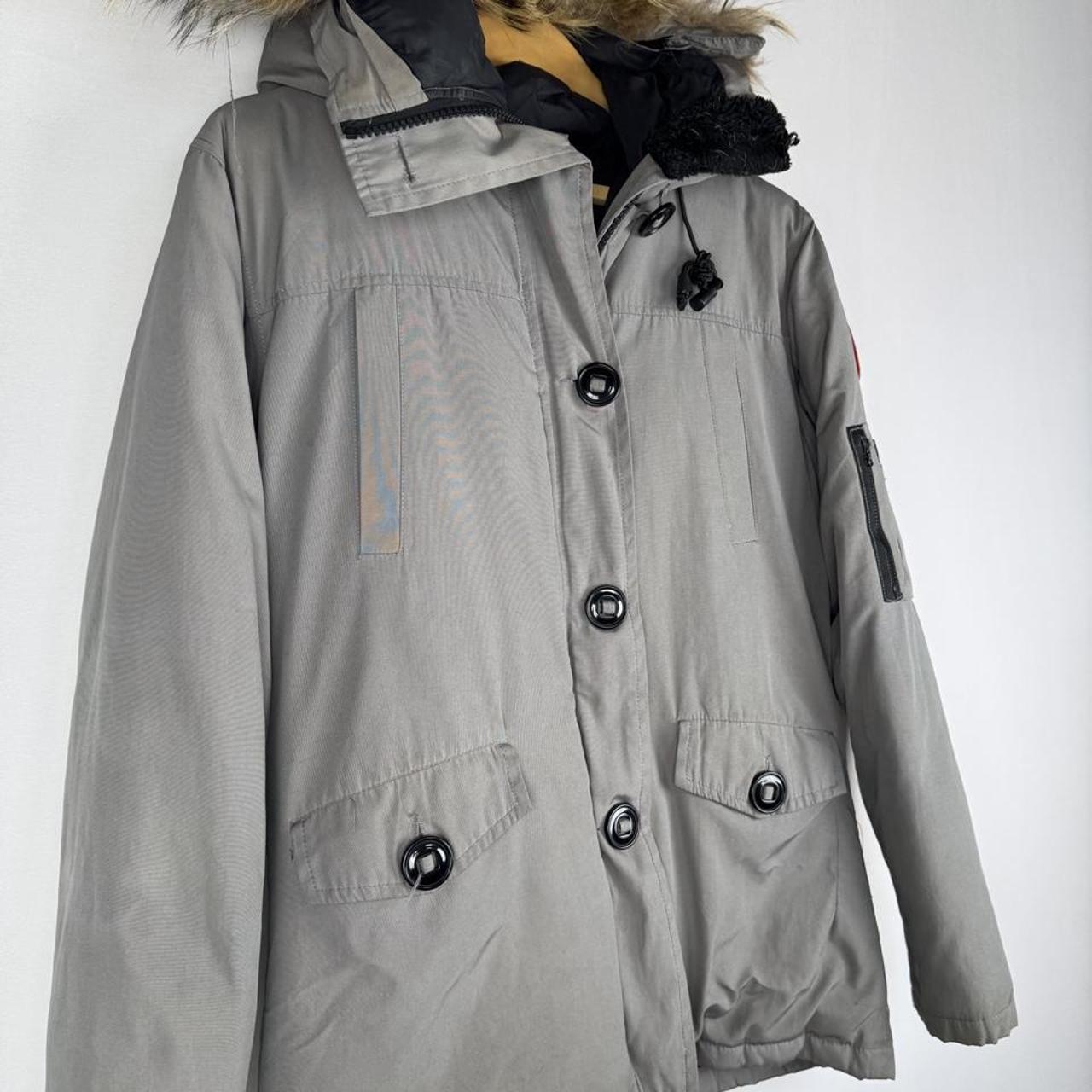 Canada Goose black Montebello parka jacket with fur-lined hood and logo patch.