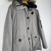 Canada Goose black Montebello parka jacket with fur-lined hood and logo patch.
