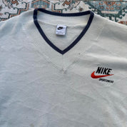 Nike cream knitted v-neck jumper with embroidered logo and visible marks on front.