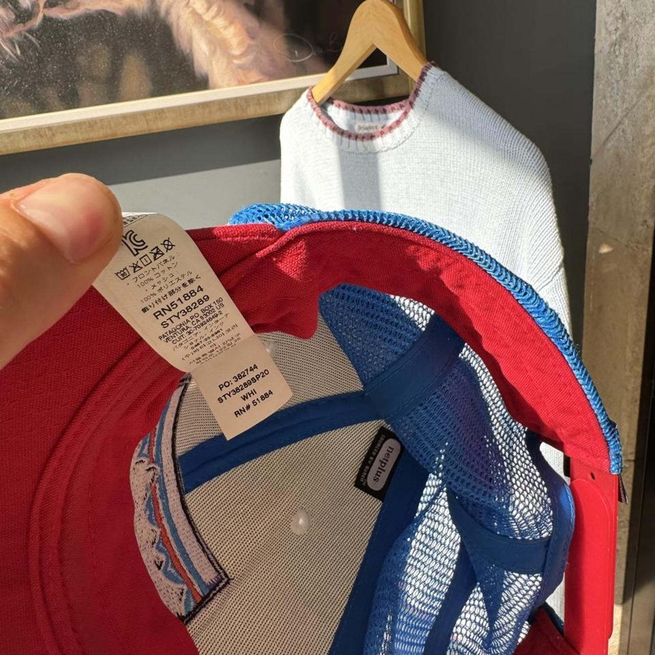 Patagonia cream trucker cap with embroidered logo and mesh back.