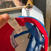 Patagonia cream trucker cap with embroidered logo and mesh back.