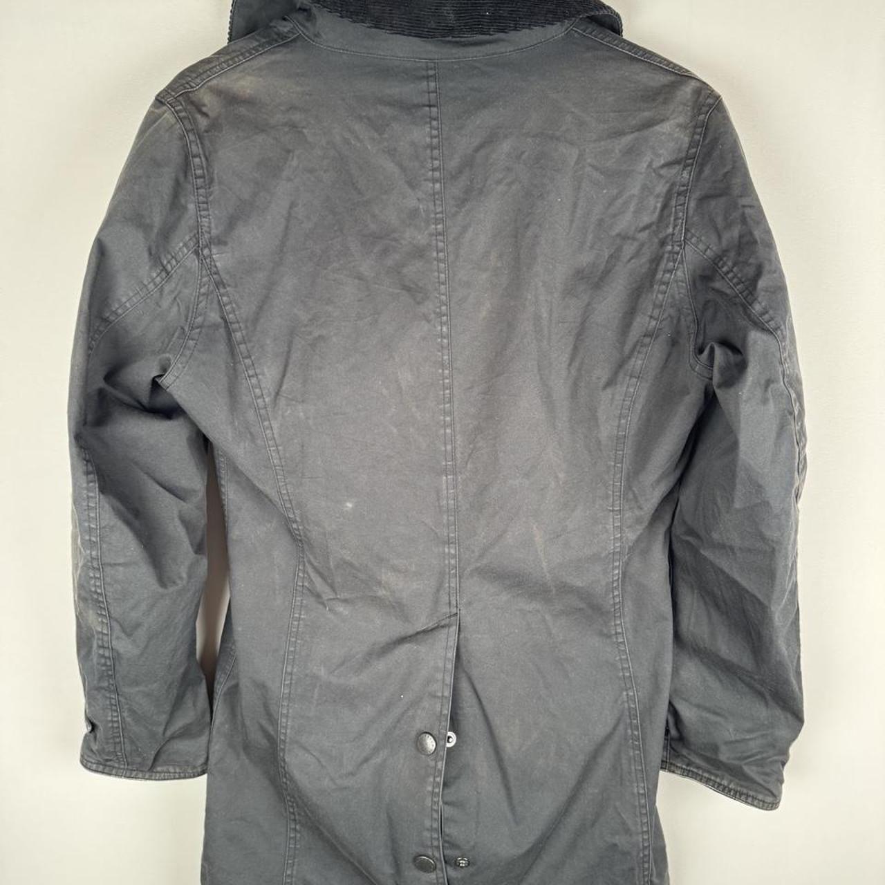 Barbour cream lightweight jacket with logo detail and slim fit design.