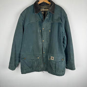Carhartt oversized chore jacket in brown with classic logo patch and durable fabric.
