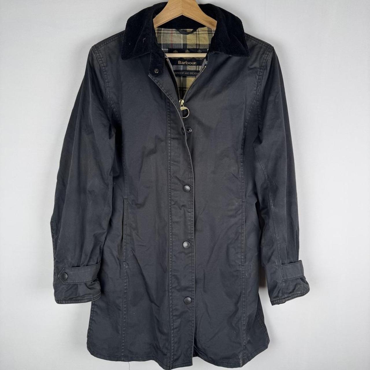 Barbour cream lightweight jacket with logo detail and slim fit design.