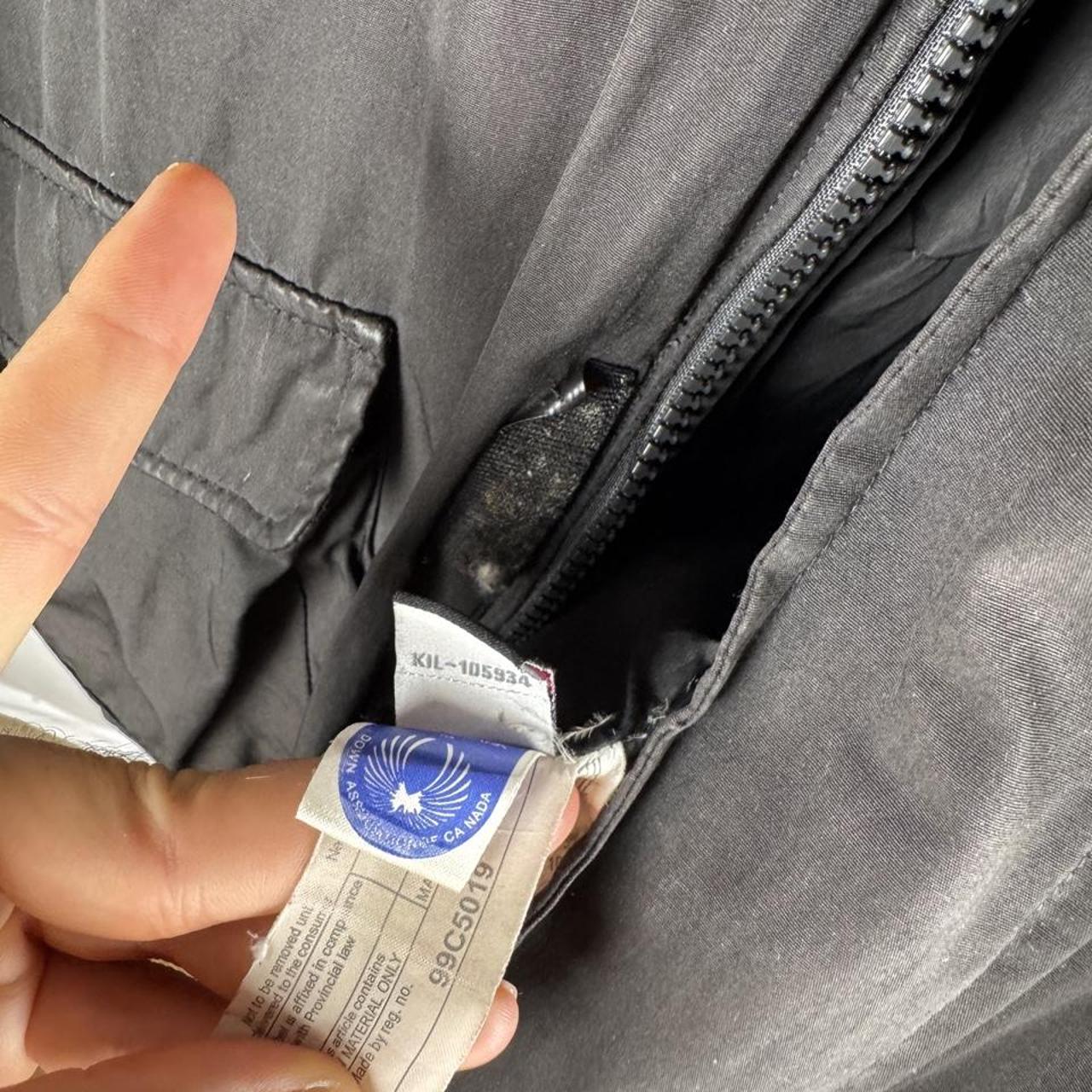 Canada Goose battered jacket black with no fur, badge, or visible holes.