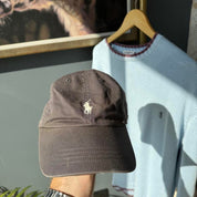 Polo Ralph Lauren stone grey cap with embroidered pony logo and green discolouration.