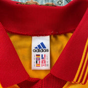 Adidas orange Benfica away jersey with embroidered logo and vintage design details.