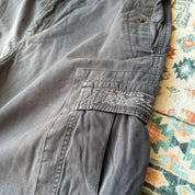 Oakley black cargo shorts with embroidered logo and tactical pockets.