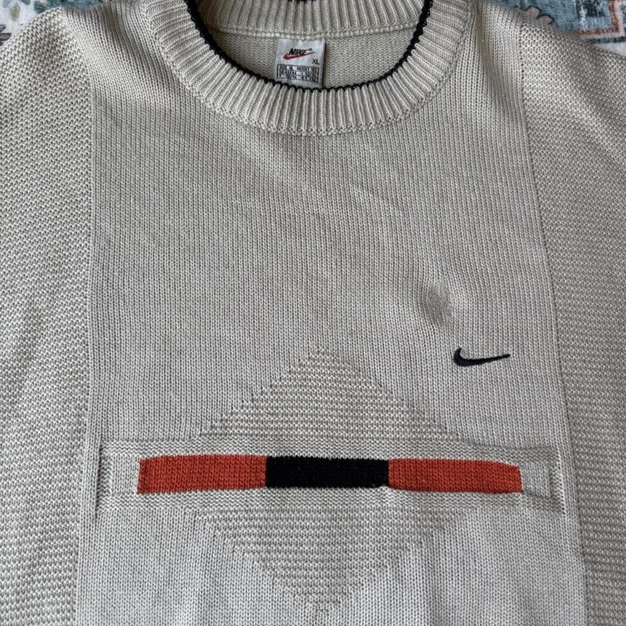 Nike cream knitted jumper with embroidered logo and visible marks from the 1990s.