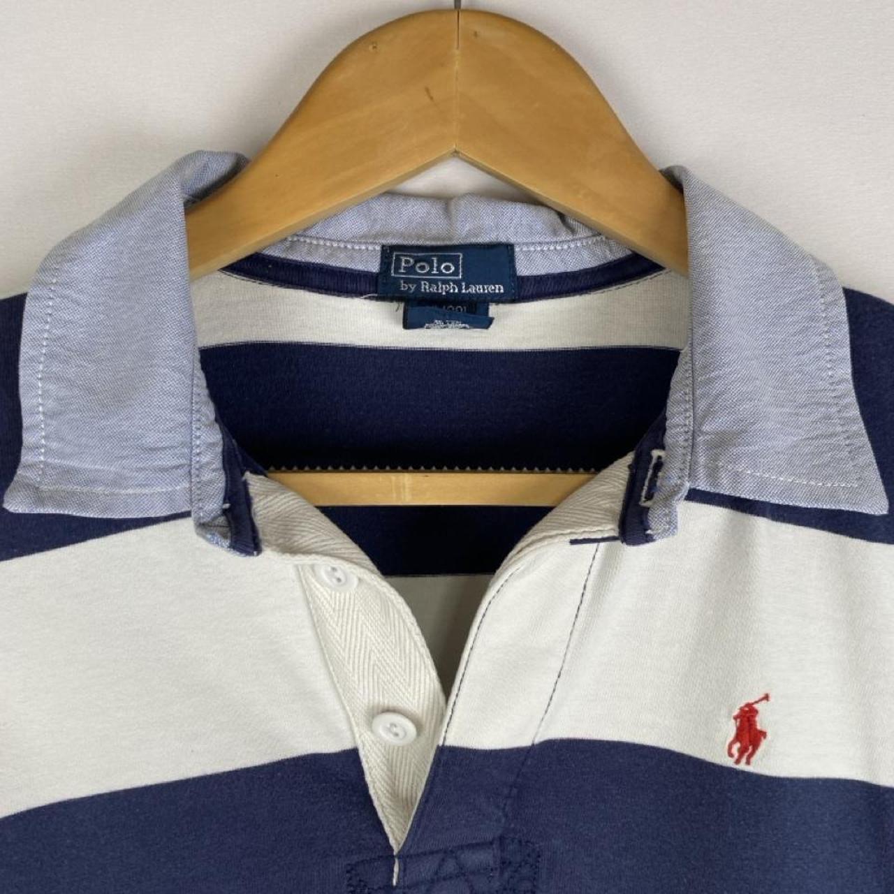 Polo Ralph Lauren blue and navy striped rugby polo shirt with logo detail.