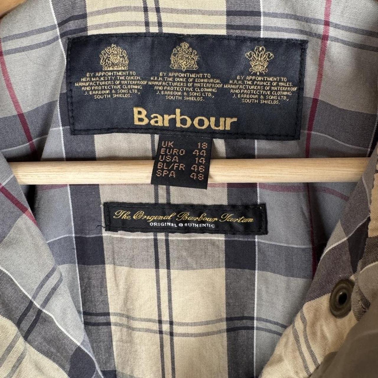 Barbour cream checkered parachute field jacket with relaxed fit and distinctive logo.