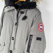 Canada Goose black Montebello parka jacket with fur-lined hood and logo patch.