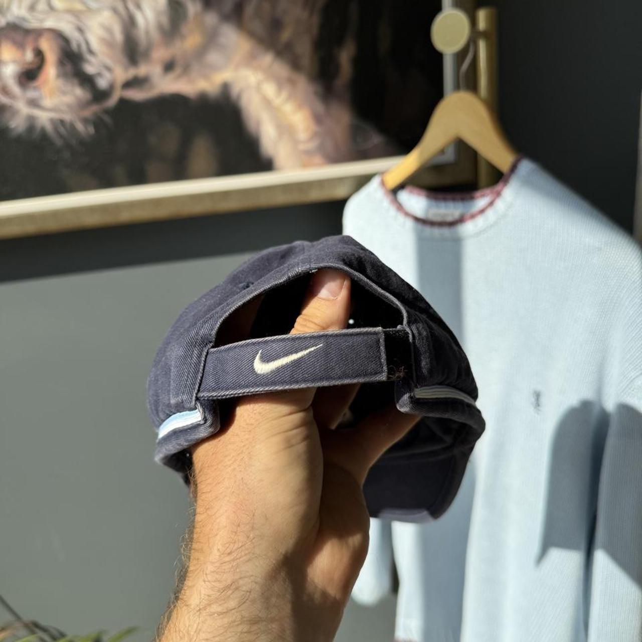 Nike cream hat featuring vintage 2000s Nike Air logo.