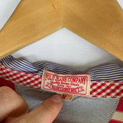 Polo Ralph Lauren red and white striped rugby polo shirt with embroidered logo.