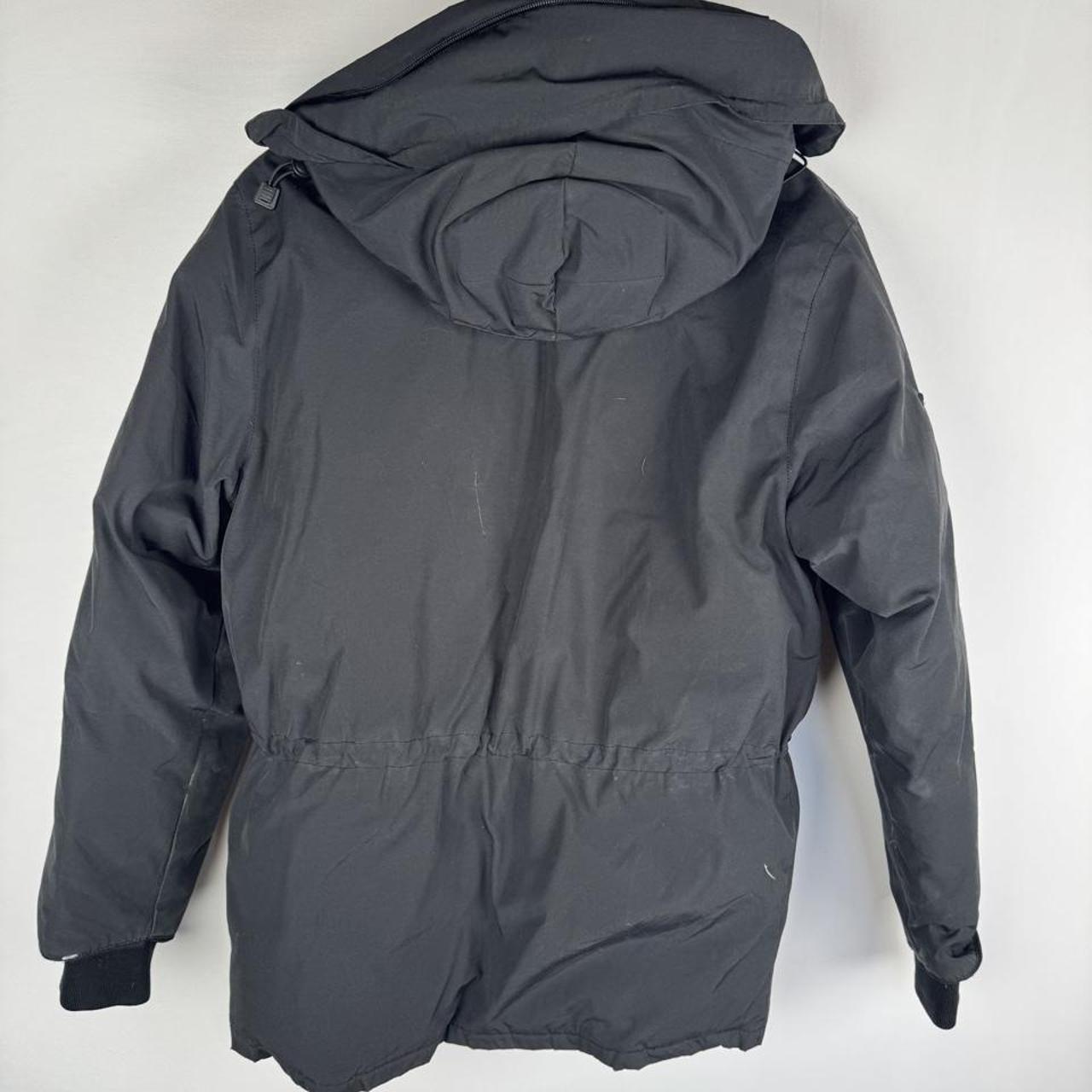 Canada Goose black parka jacket oversized fit with utility pockets and logo patch.