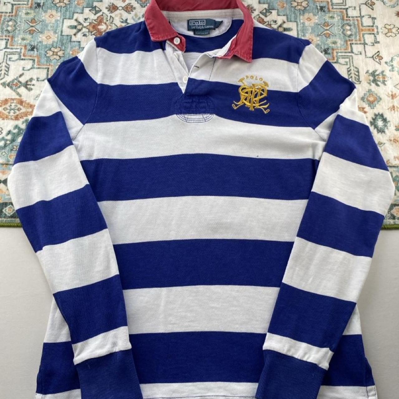 Polo Ralph Lauren blue and white striped rugby polo shirt with embroidered logo.