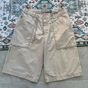 Quiksilver cream jorts with classic logo patch and vintage style from early 2000s.